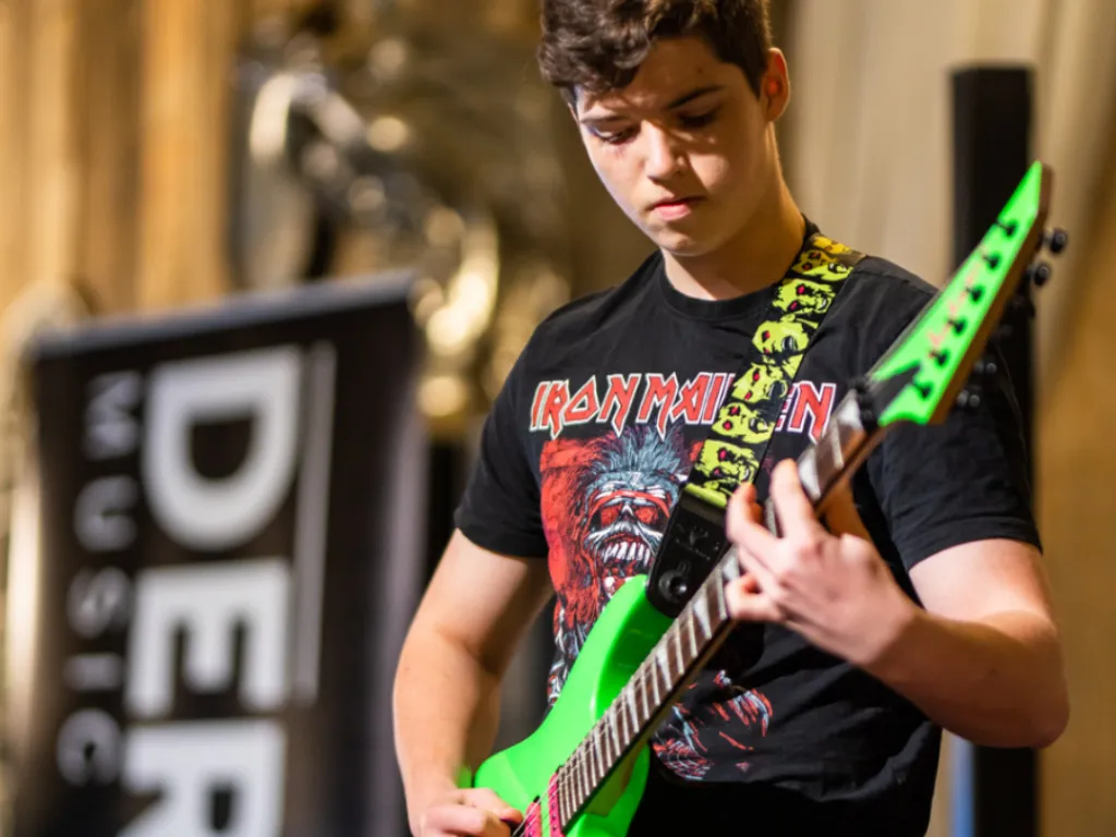 A student performs at a DeRosa Music Academy showcase